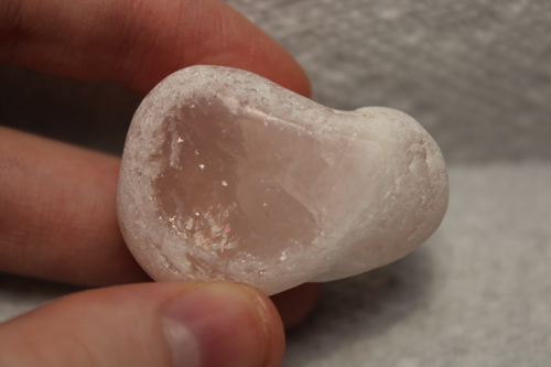 Polished clear pink stone.